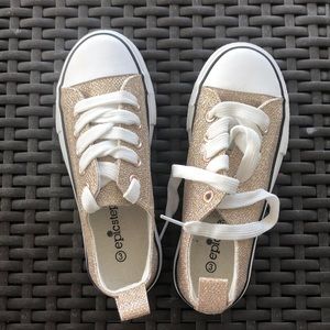 Girls gold sparkle shoes.